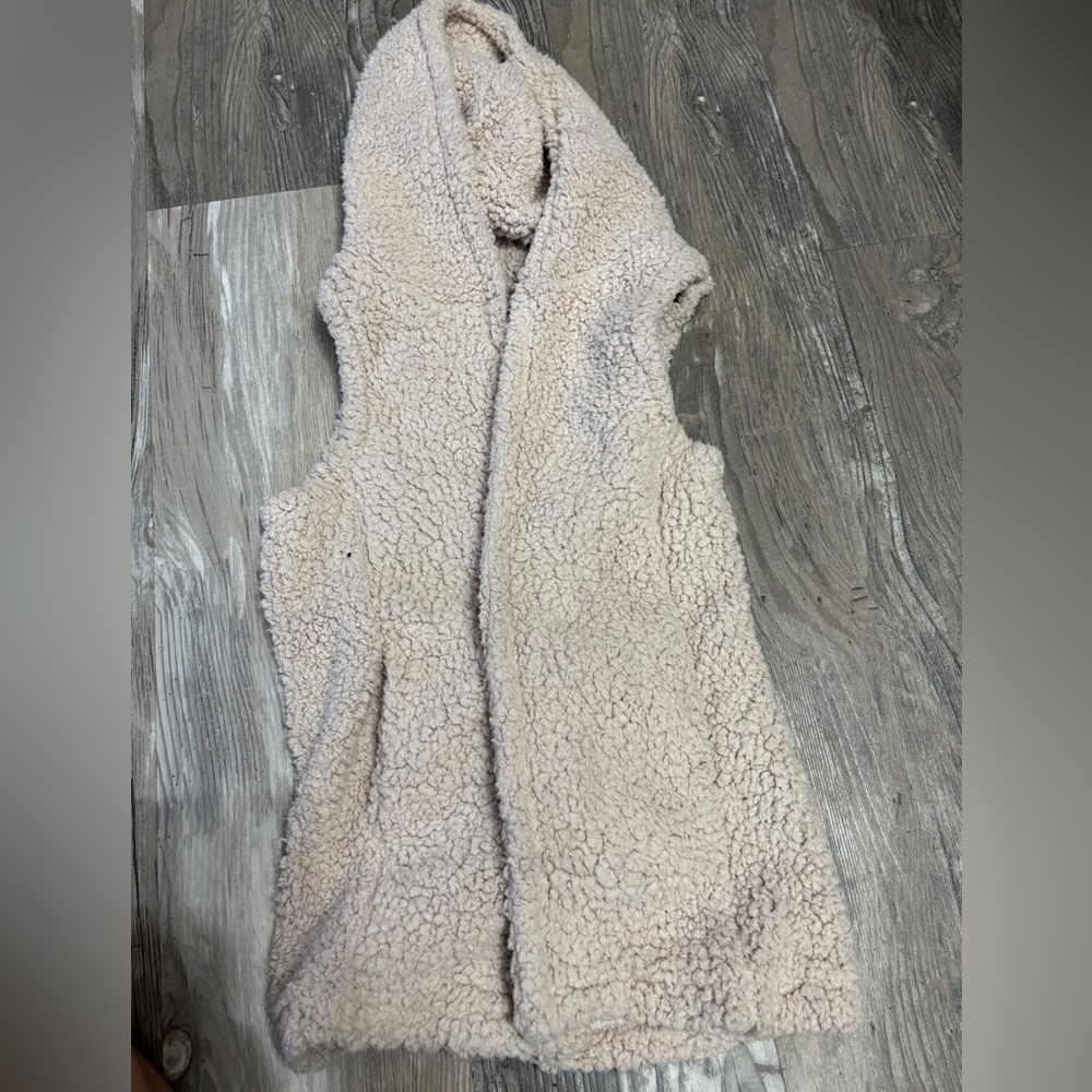 Soft vest with a hood